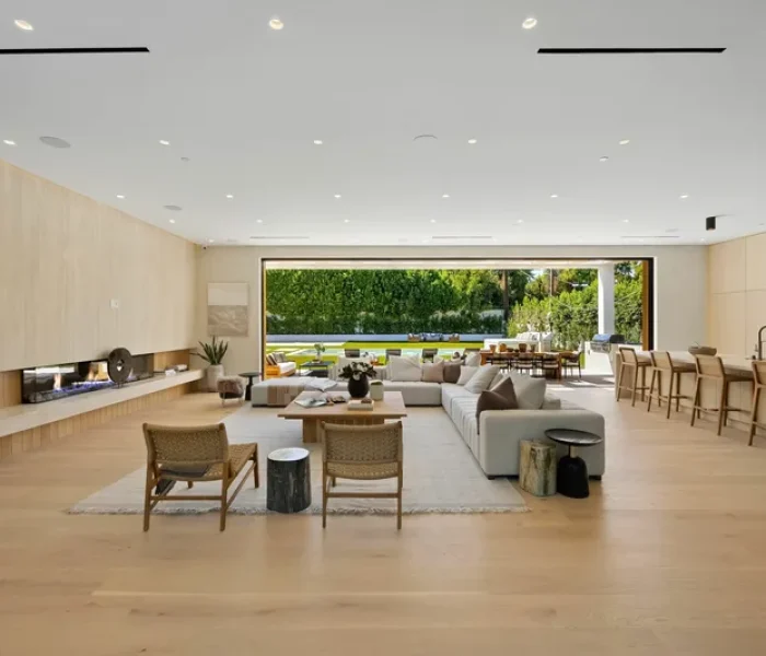 Open-concept San Jose home addition with expanded living room, modern fireplace, and seamless indoor-outdoor connection